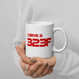 I Drive A 323F mug