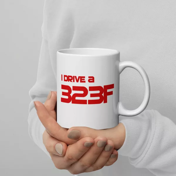 I Drive A 323F mug